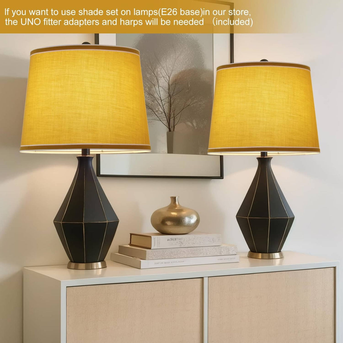 Pair of yellow drum lamp shades with white trim on black base table lamps