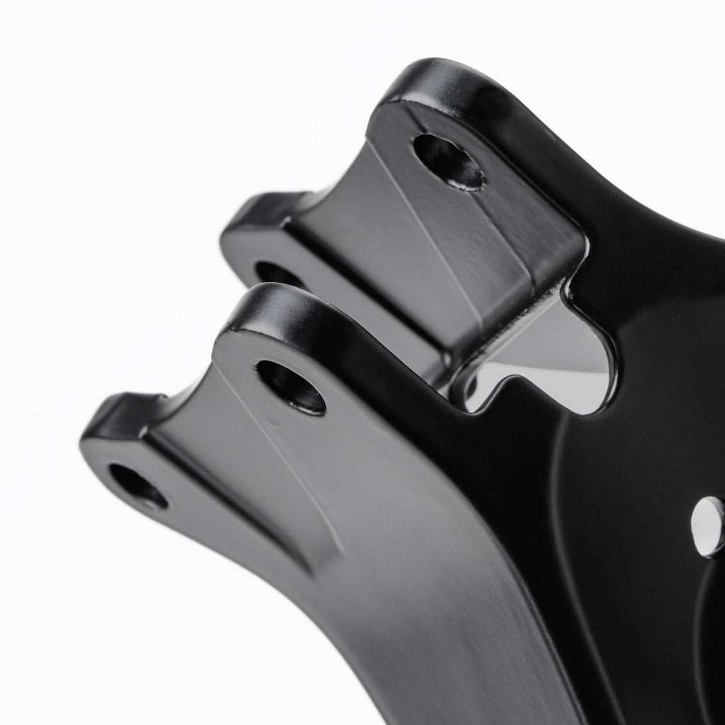 Black mounting bracket tab with two circular holes in close-up