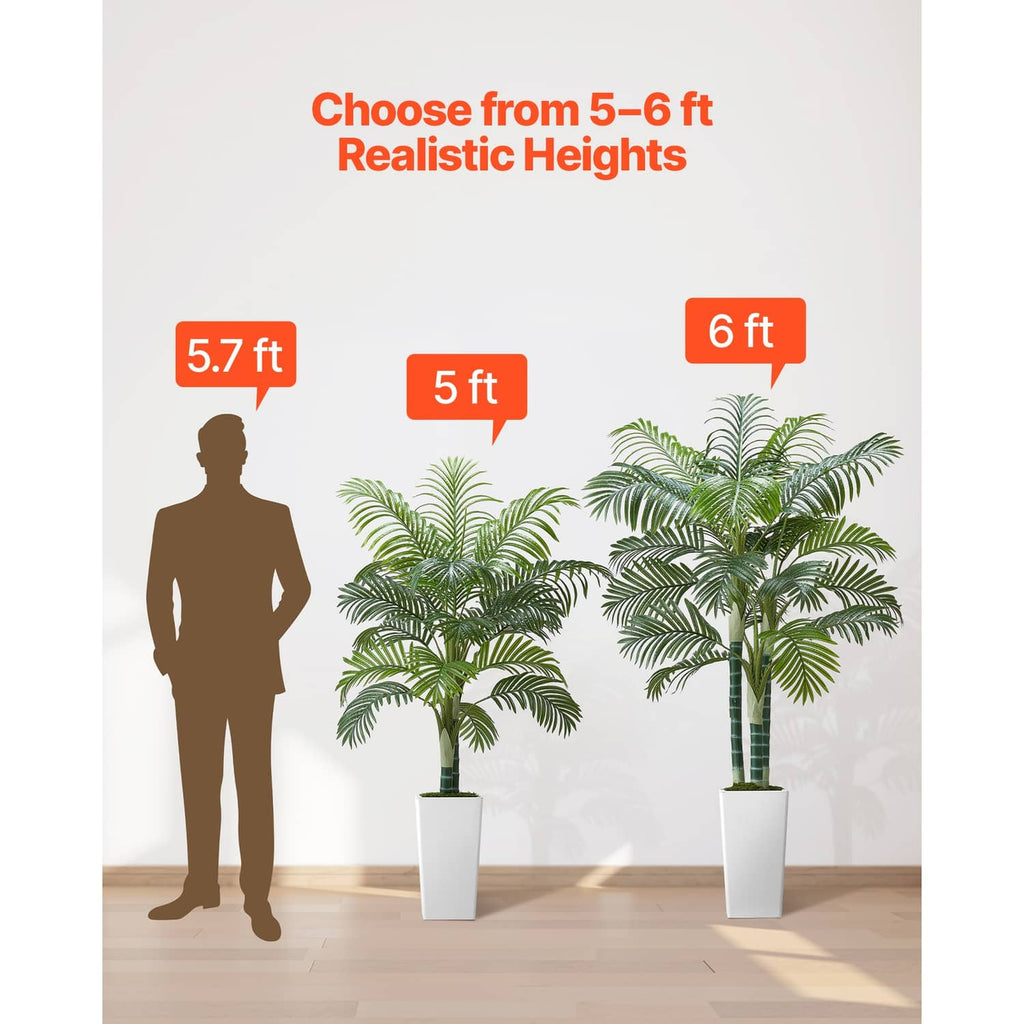 Set of faux areca palm trees in white pots showing different heights