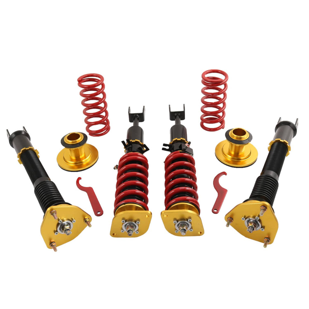 Coilover suspension kit with black shocks, red springs, and gold height-adjust hardware