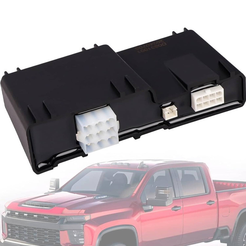 Black control module with white connector blocks mounted above a pickup truck