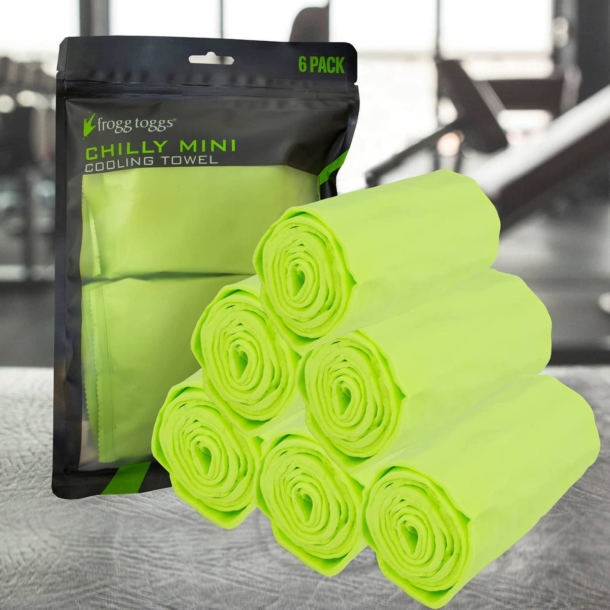 Lime Chilly Mini cooling towels rolled in front of 6-pack pouch