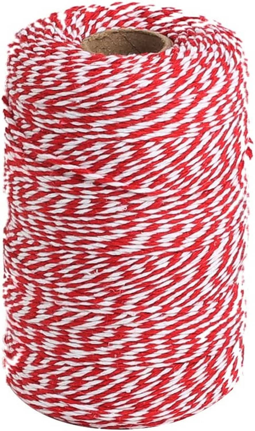 Red and white bakers twine roll with spiraled cotton ribbon wrap on cardboard core
