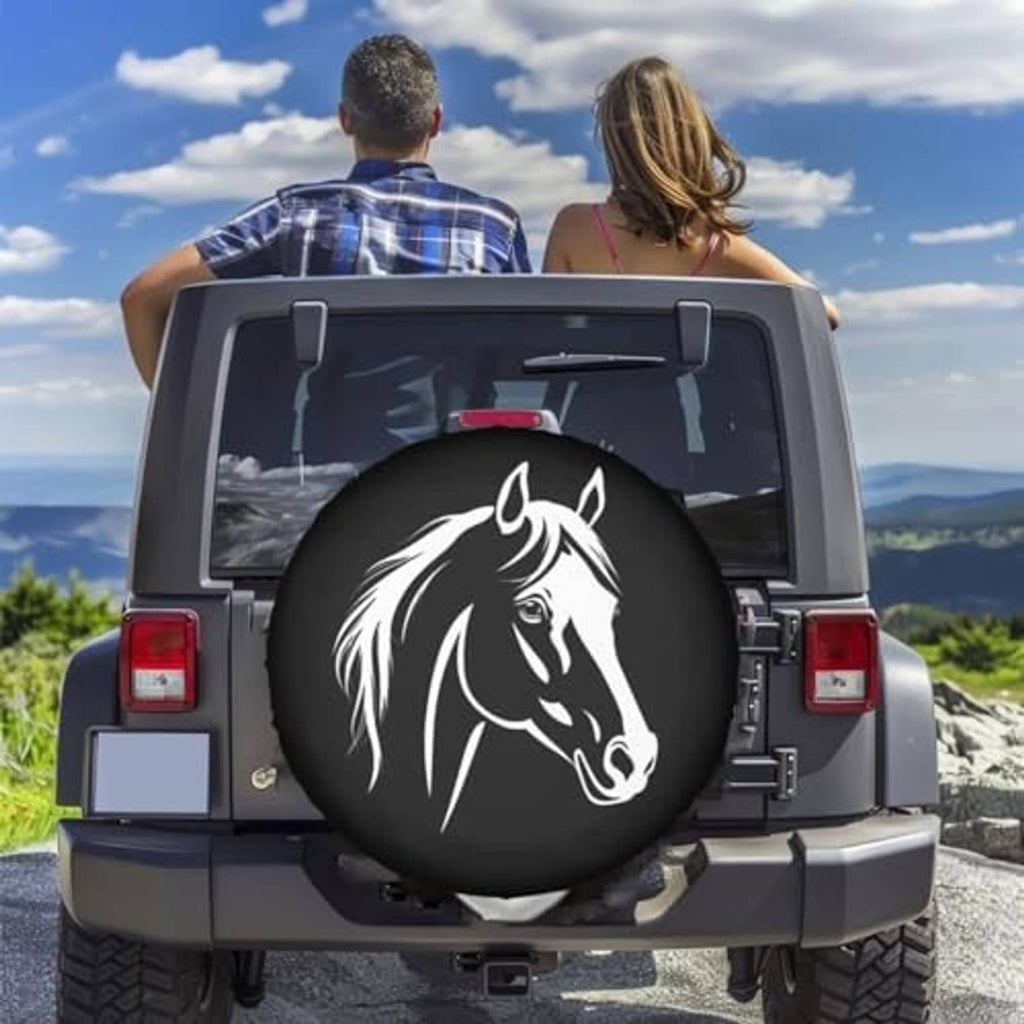 Black spare tire cover with white horse head graphic on back of SUV