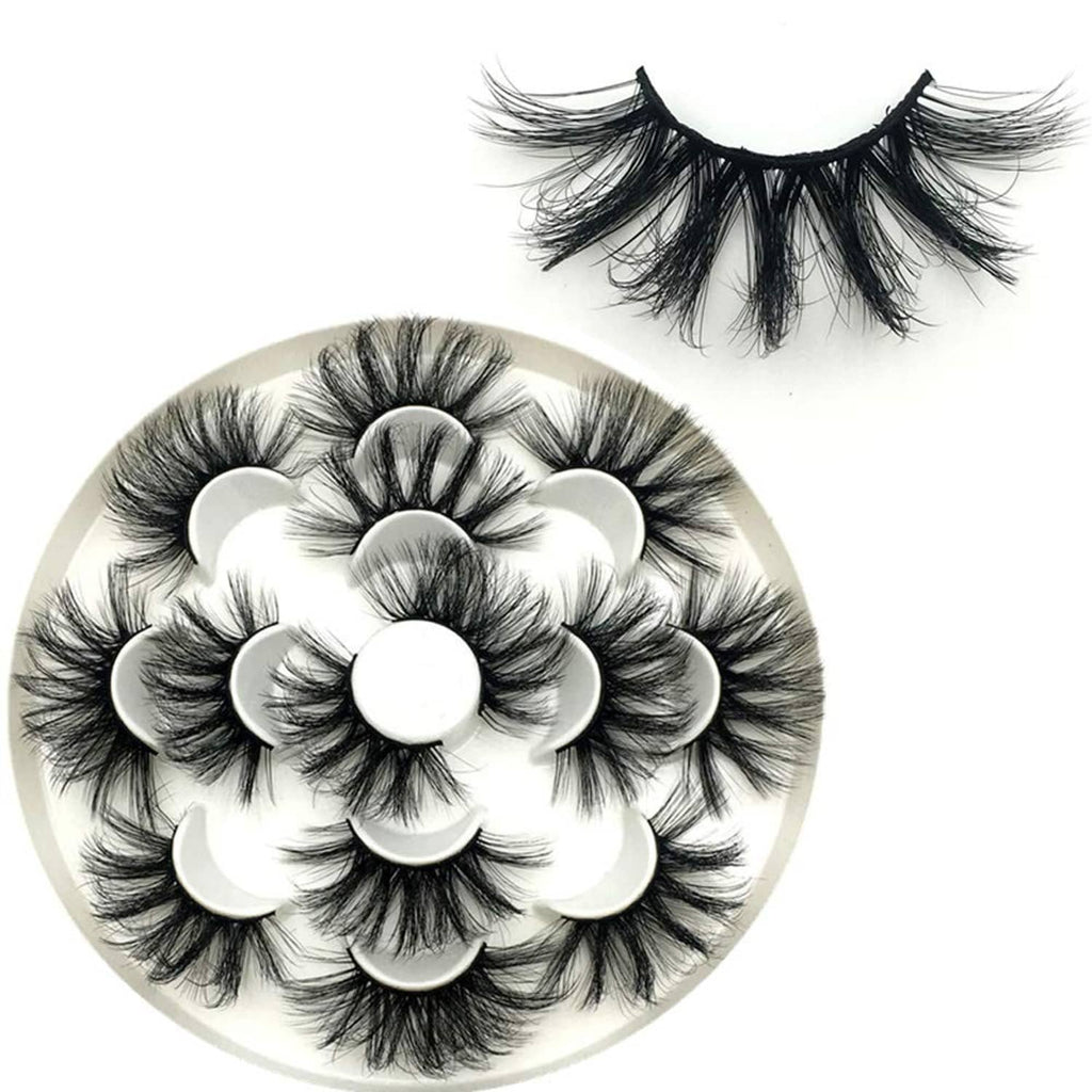 Long wispy black false eyelashes with layered clusters displayed on a round tray.