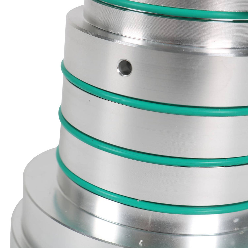 Metal drum tester insert with green sealing rings and circular hole detail
