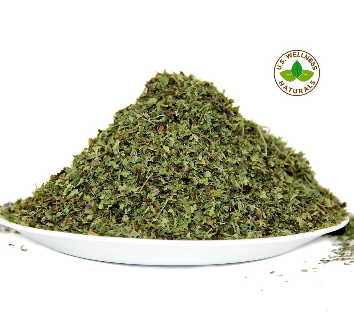 Dried lemon balm leaves mound on white plate with wellness seal
