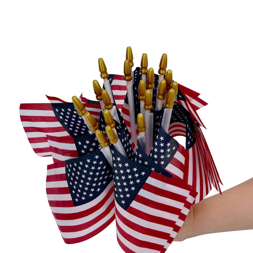 Bundle of small US flags on wooden sticks with gold tips