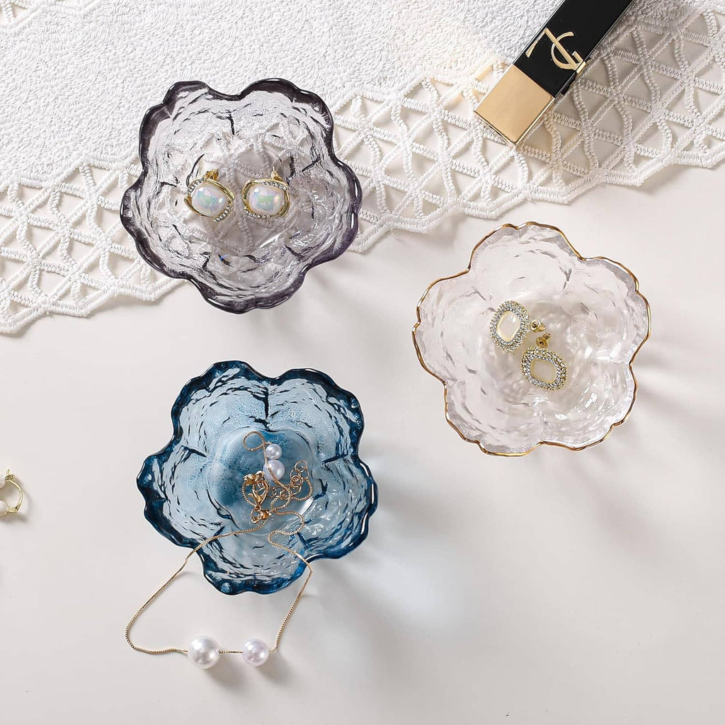 Flower-shaped trinket dish trio: clear, blue, and dark gray with iridescent insets