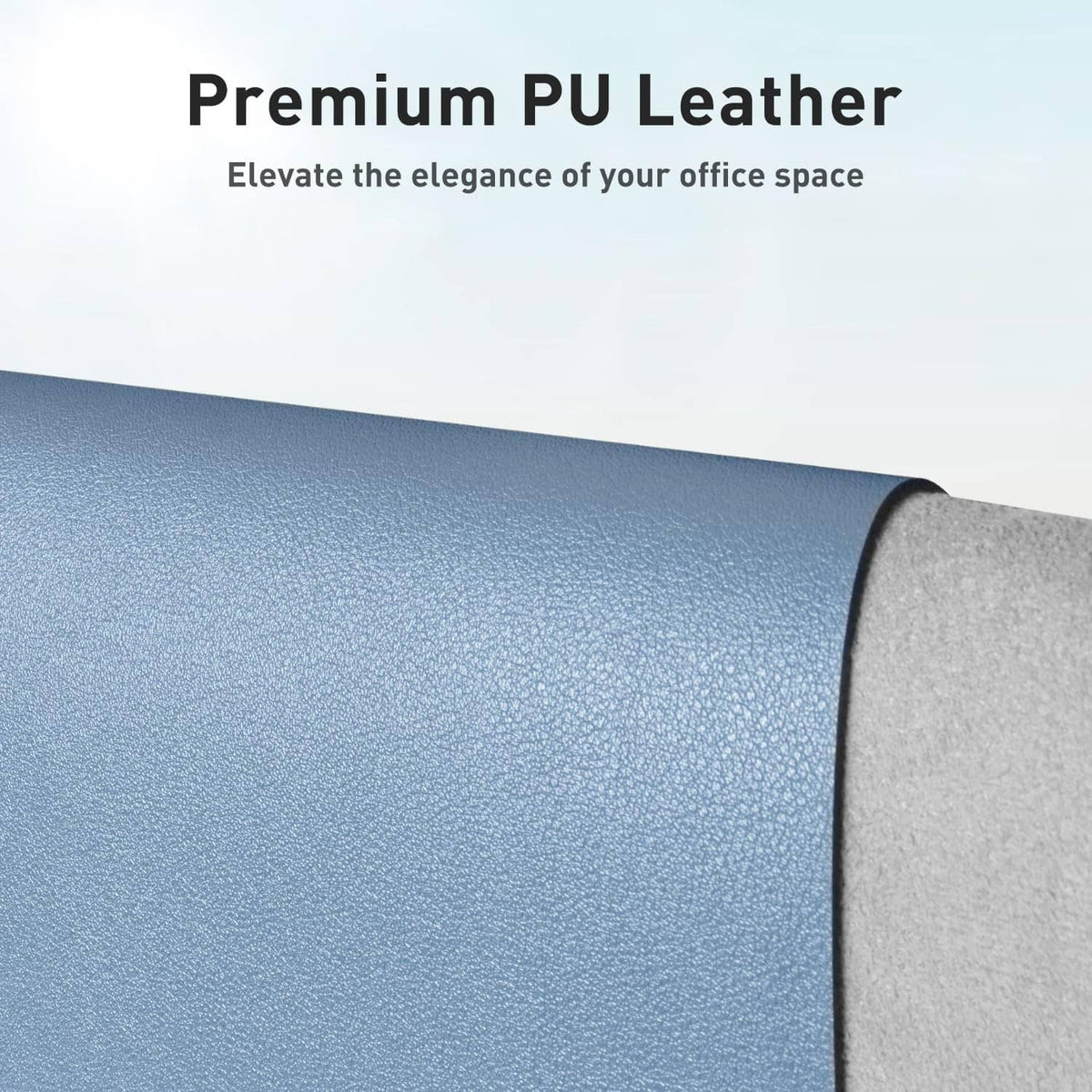 Denim blue PU leather desk pad protector, close-up pebbled texture and curved edge