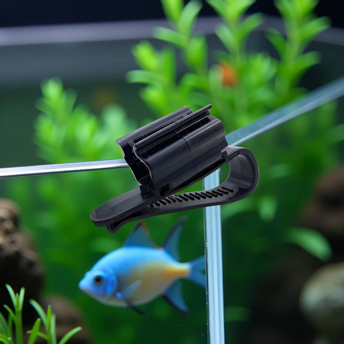 Black aquarium hose holder clip with ridged base and curved clamp arm
