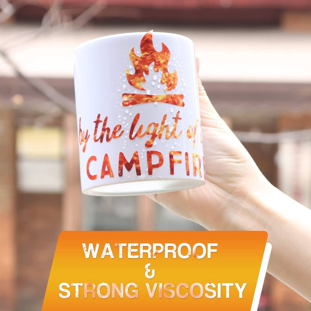 Flame vinyl decal applied to a mug, glossy orange fire graphic on white cup