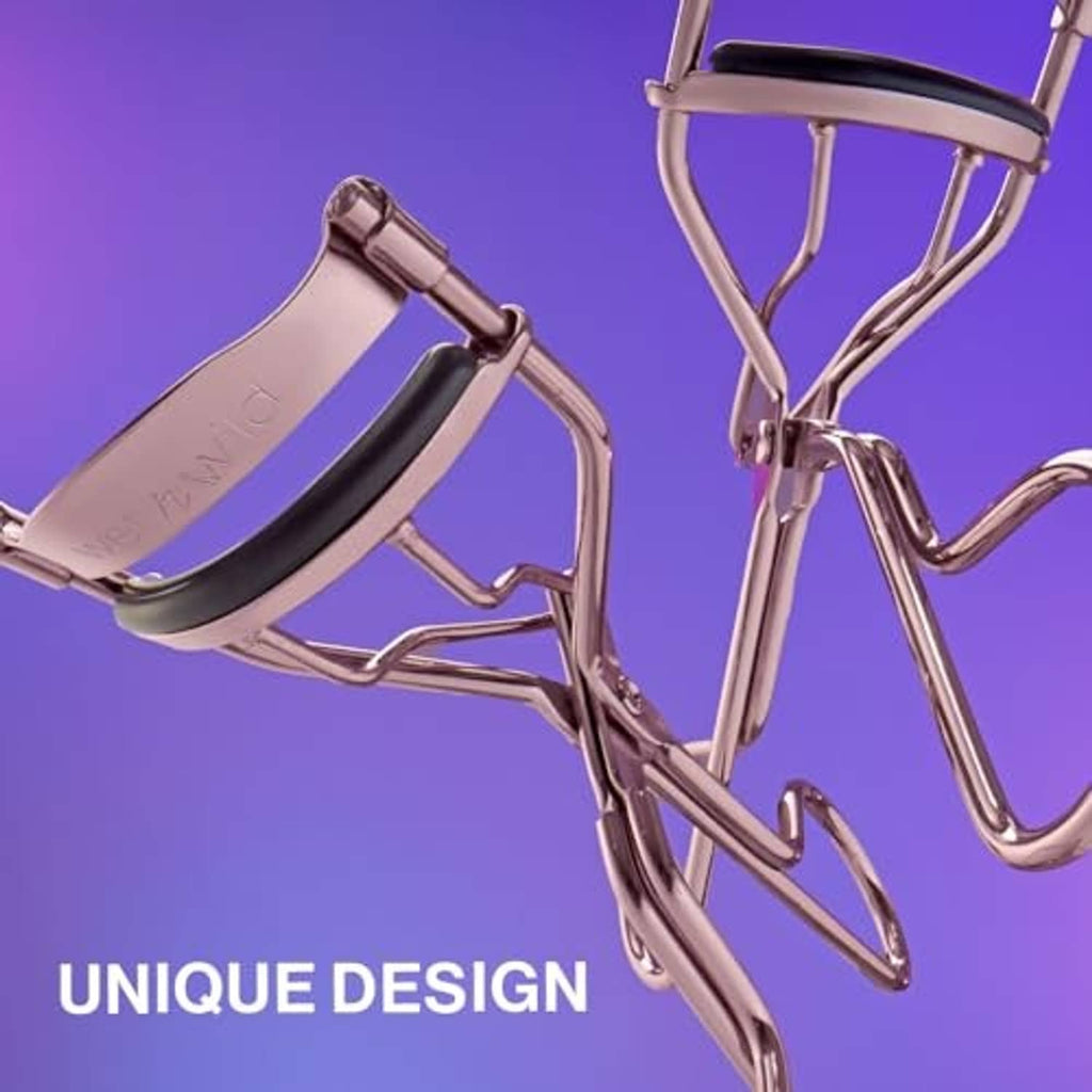 Rose gold eyelash curler with black pad and curved chrome arms