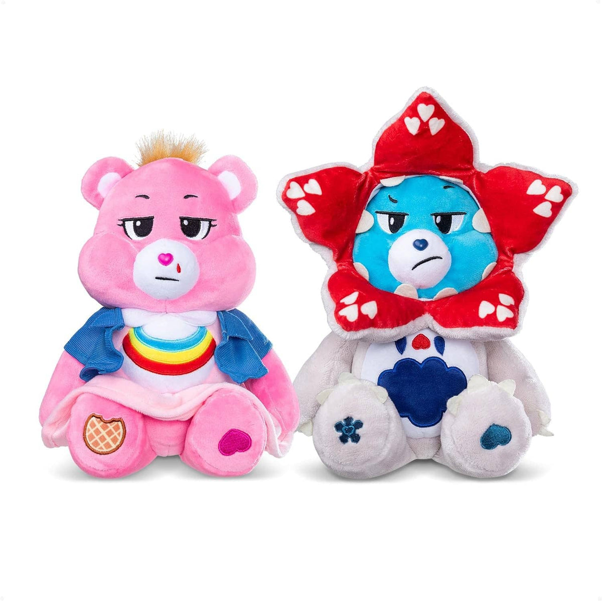 Two plush bear characters: pink bear in blue dress and blue bear in red heart hood