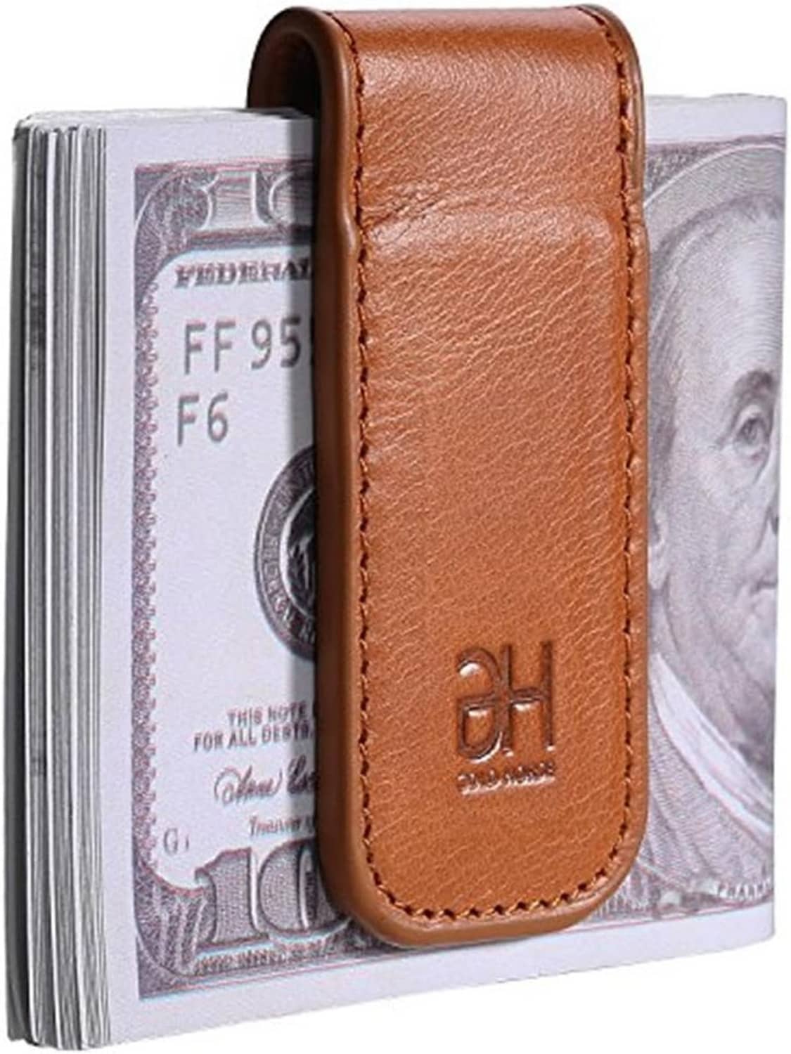 Brown genuine leather money clip with embossed logo, holding folded cash and cards