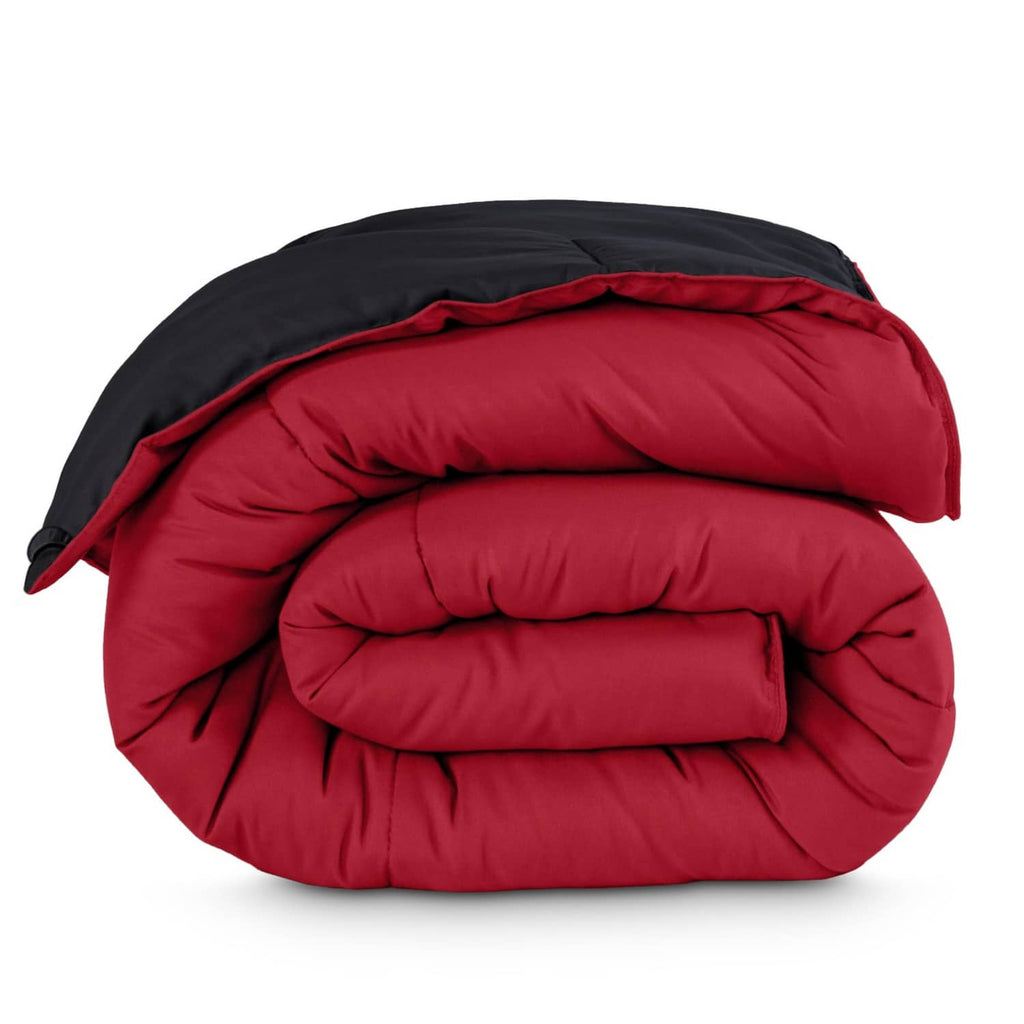 Reversible comforter blanket, black outer with red inner, quilted baffle stitching.