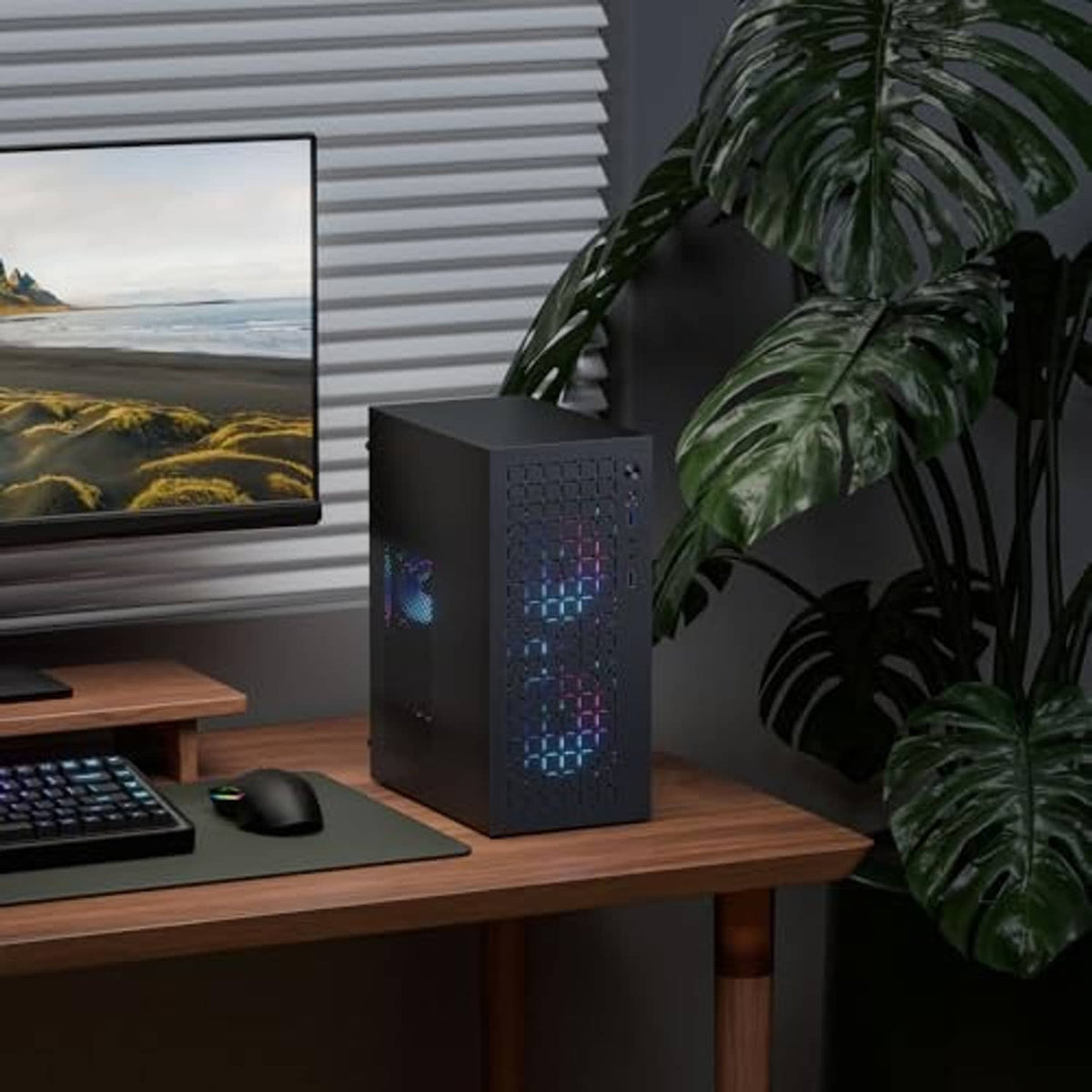 Black mini PC tower case with mesh front and RGB-style light pattern