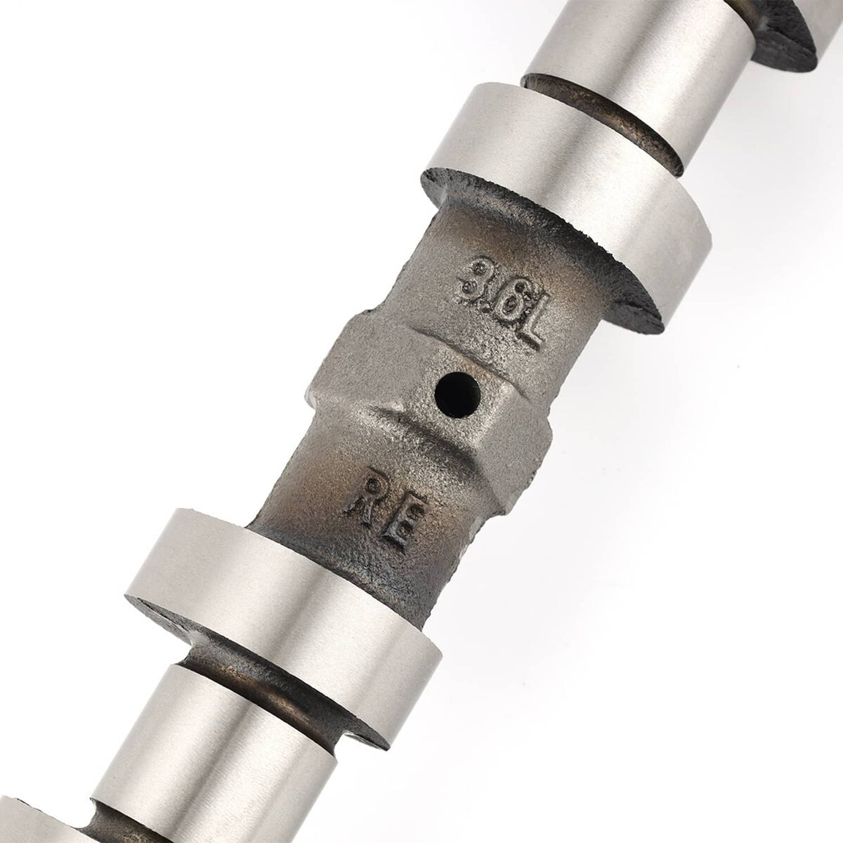 Right side exhaust camshaft close-up of stamped silver fork-like support
