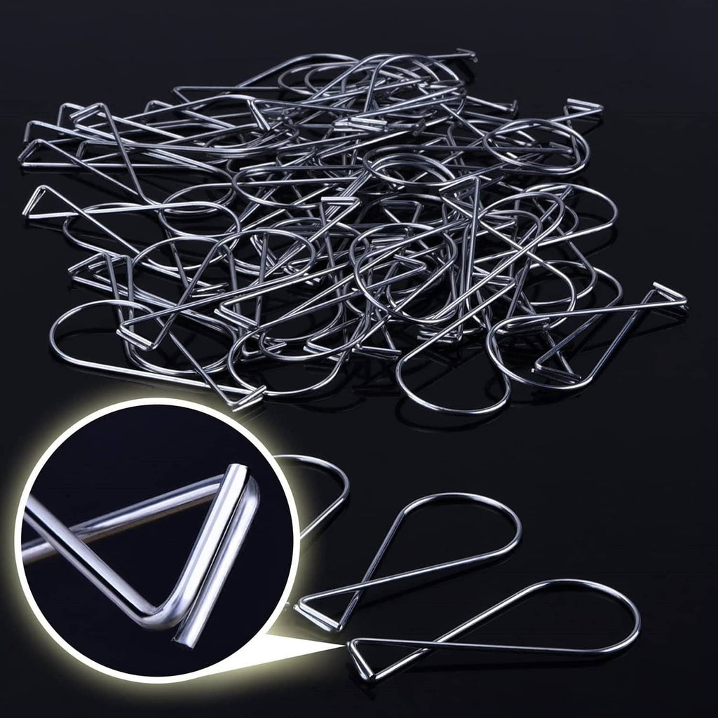 Pile of silver ceiling hook clips, metal wire loop ends for drop ceiling tiles