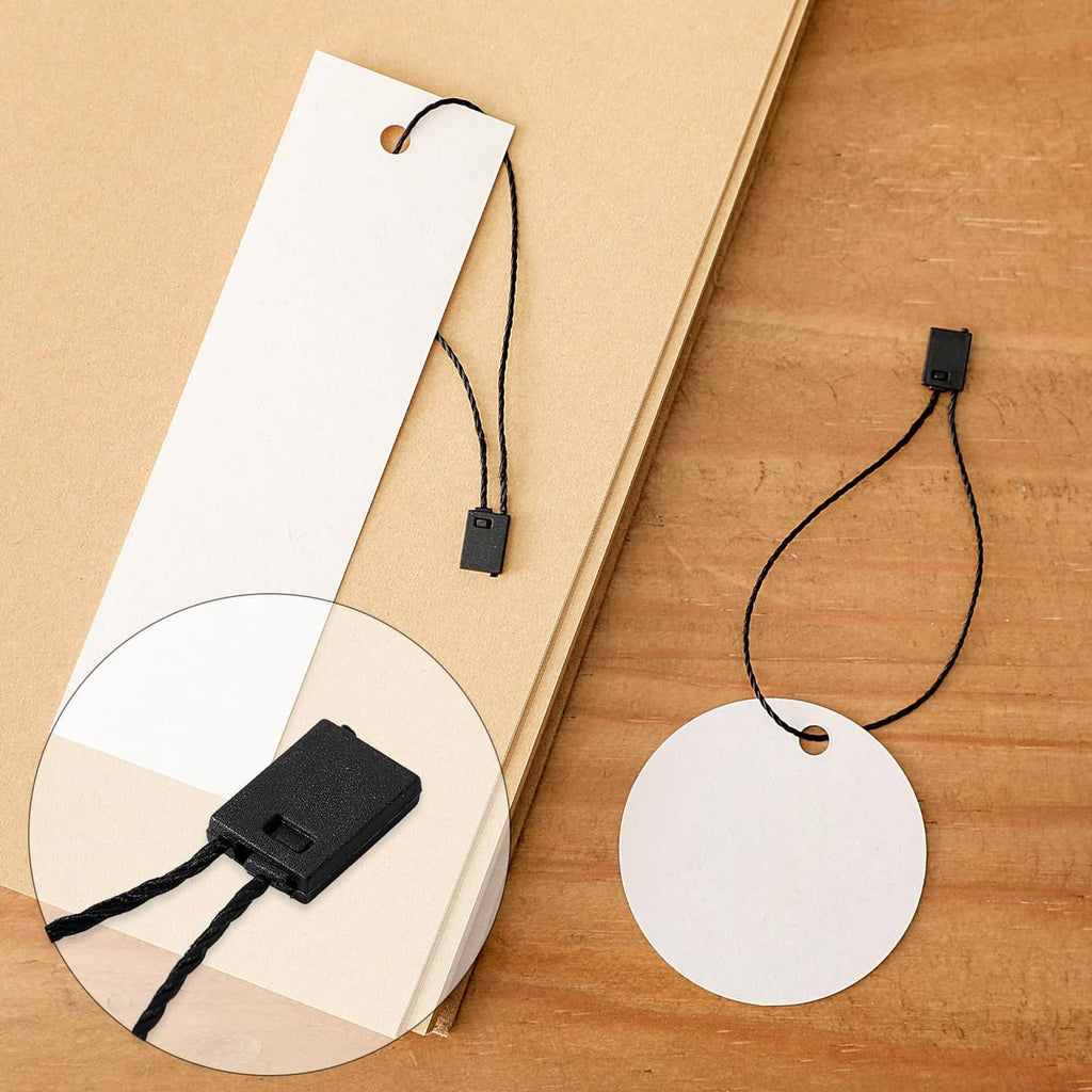 Two hang tags with black loop strings and rectangular snap-lock clip fasteners