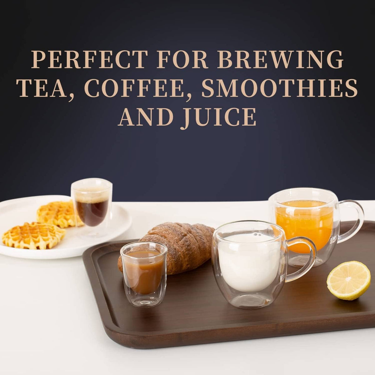 Clear double-wall espresso cups with side handles, filled drinks on a tray