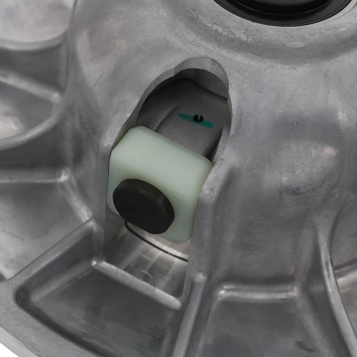Secondary driven clutch damper block with teal insert inside gray housing