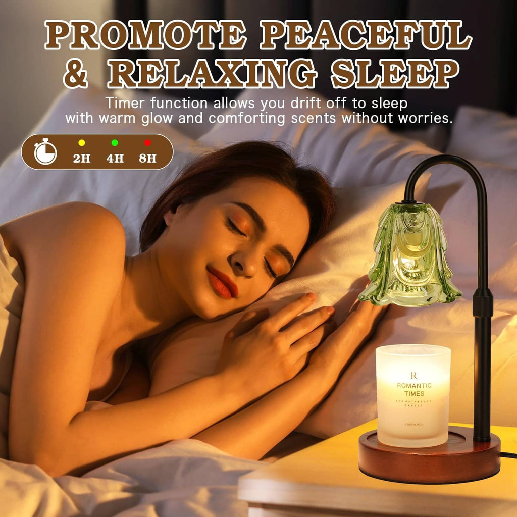 Green glass candle warmer lamp with black stand, glowing candle jar beside bed