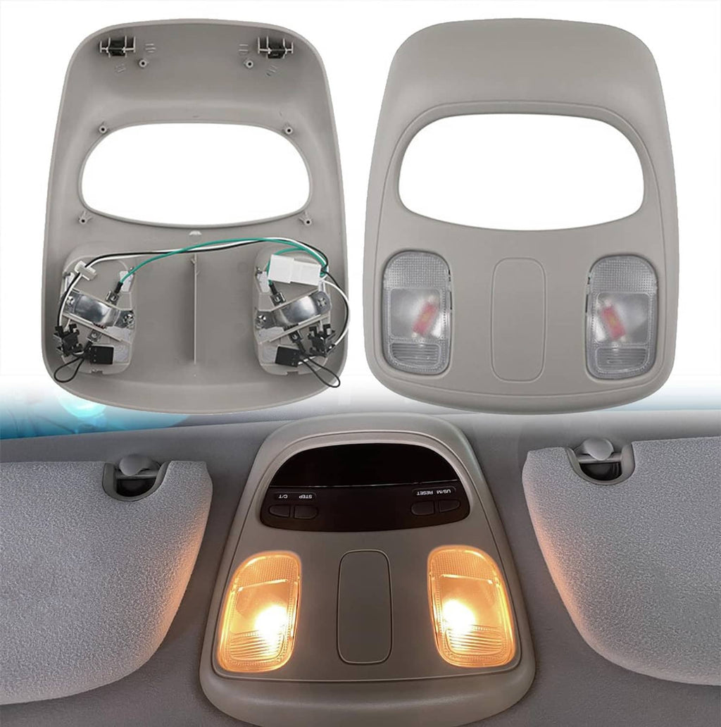 Grey overhead map light console housing with two clear lens lamps and center switch panel
