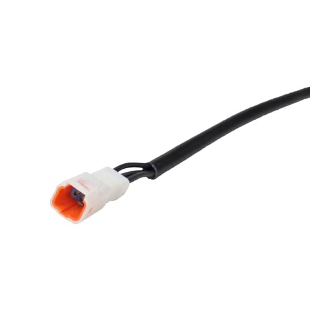 White and orange electrical connector on black sensor cable