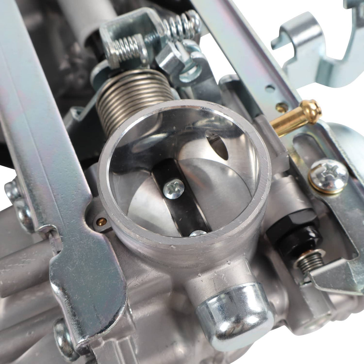 Carburetor throttle bore close-up with metal housing and threaded fittings