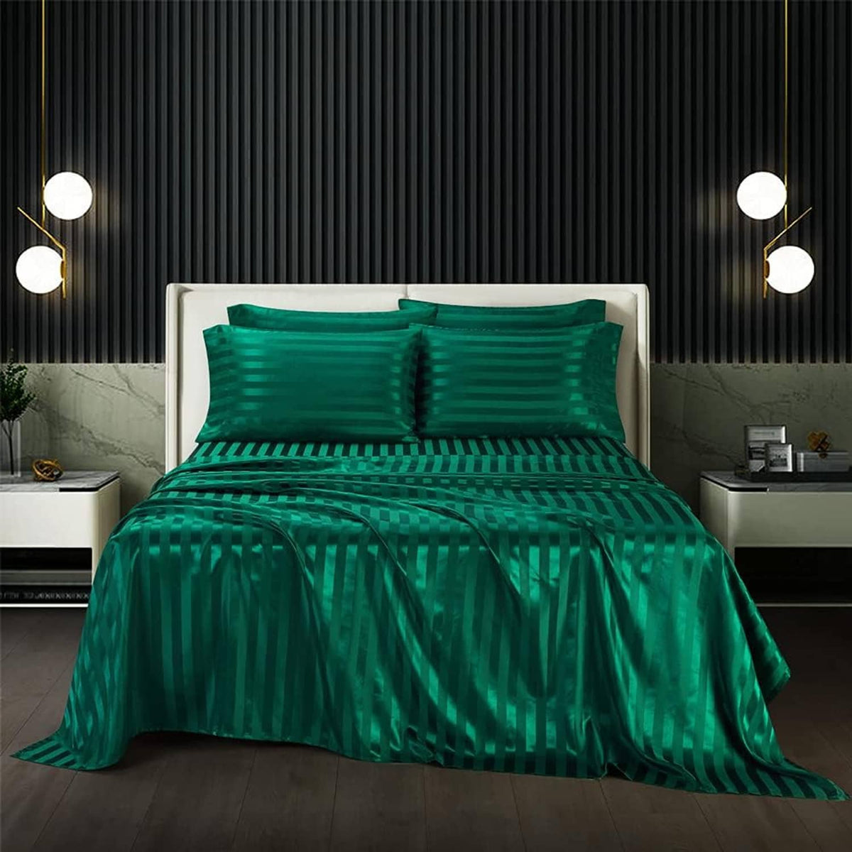 Teal green striped satin sheet set on bed with matching pillowcases and duvet cover
