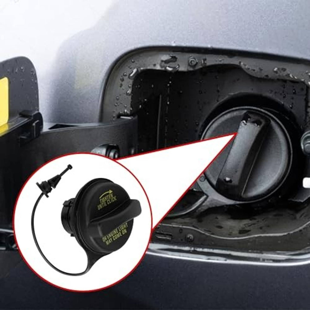 Fuel tank filler gas cap with vent hose shown from the vehicle opening