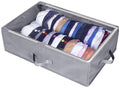 Gray foldable hat storage box with clear top window, holding stacked baseball caps