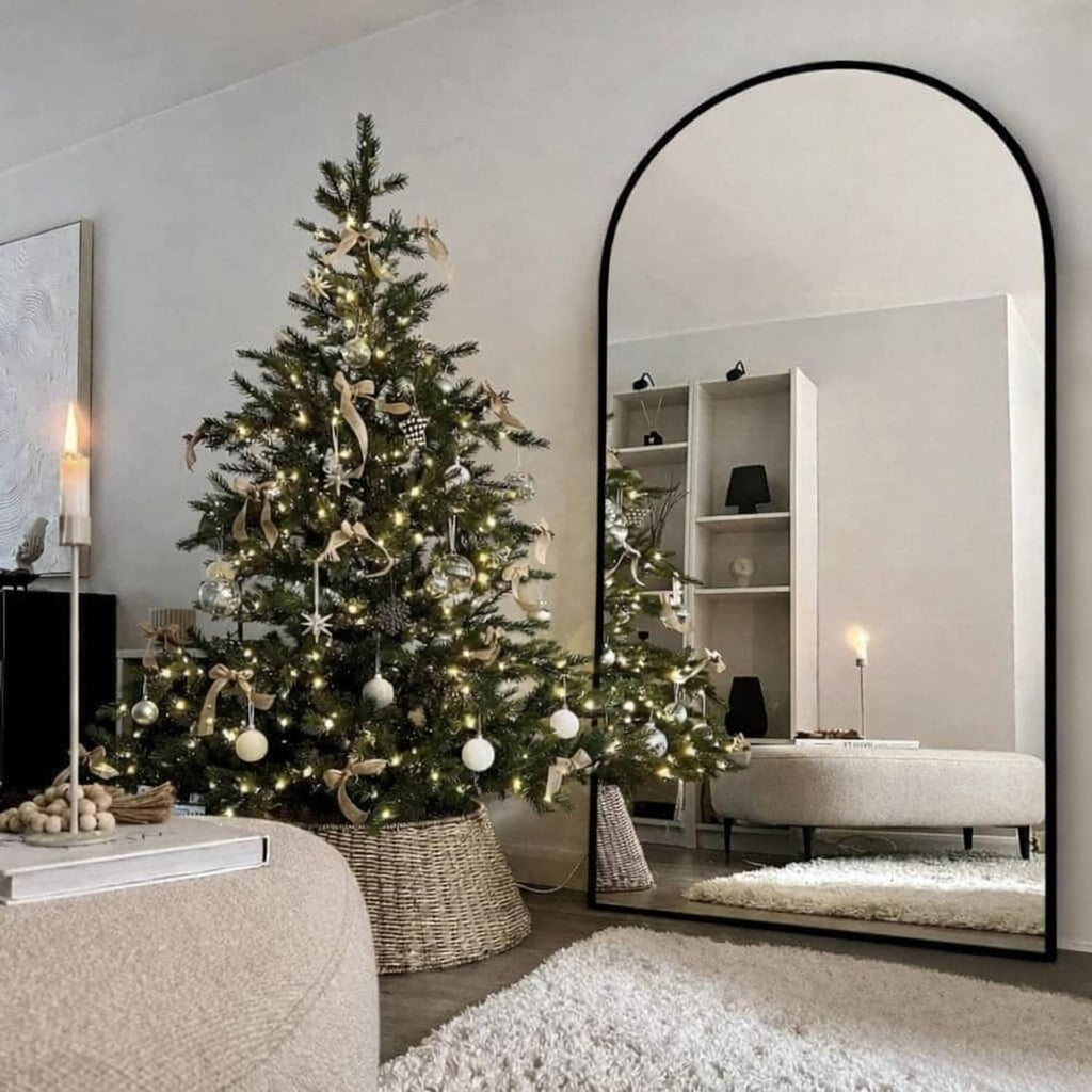 Standing arched floor mirror with black frame for full-body reflections