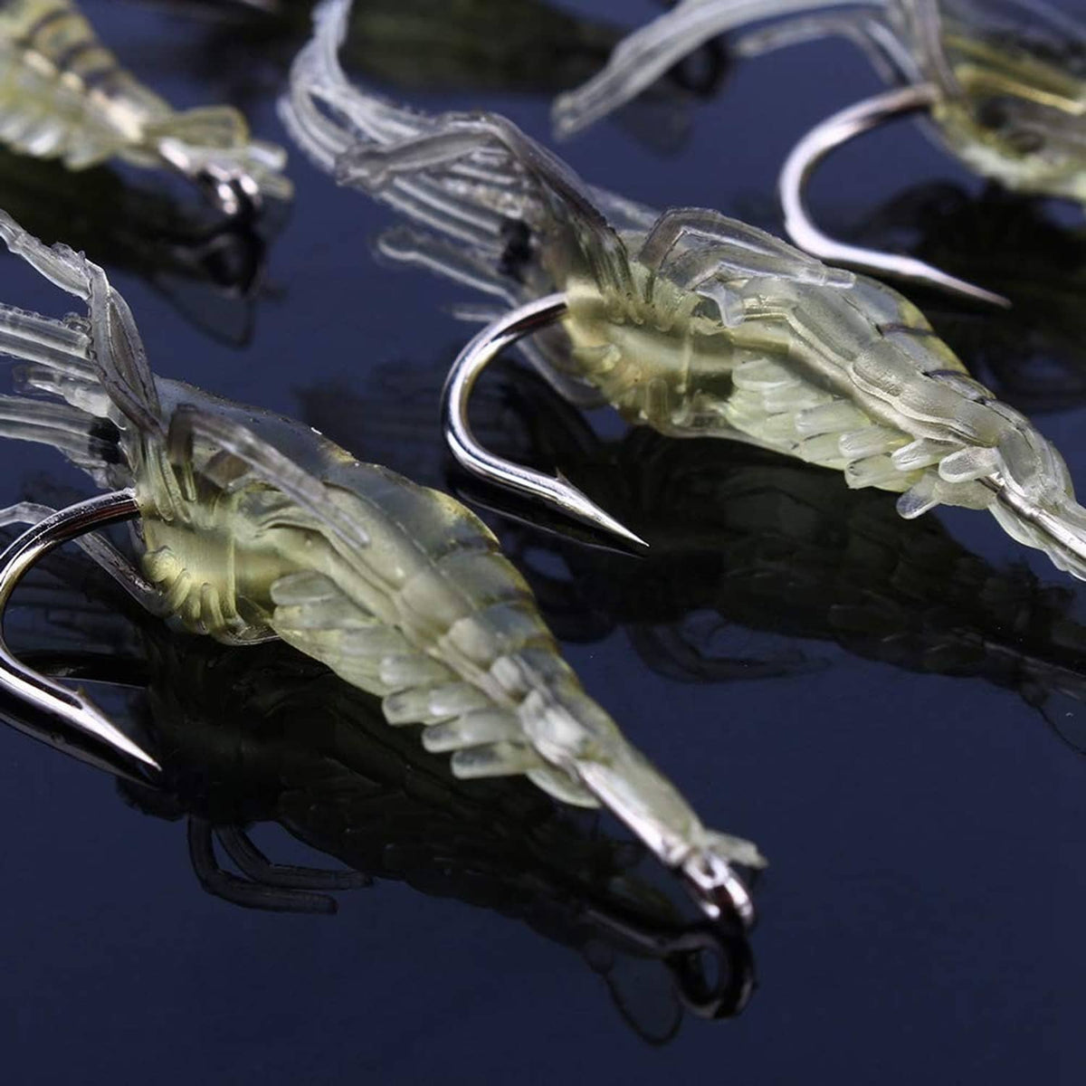 Yellow translucent shrimp prawn soft lure close-up with curved hook and legs