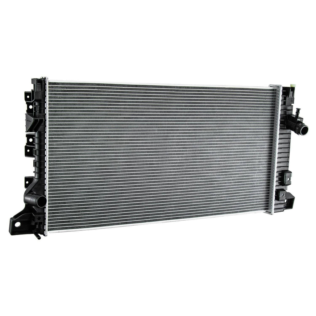 Vehicle radiator front view with silver cooling fins and black hose connections