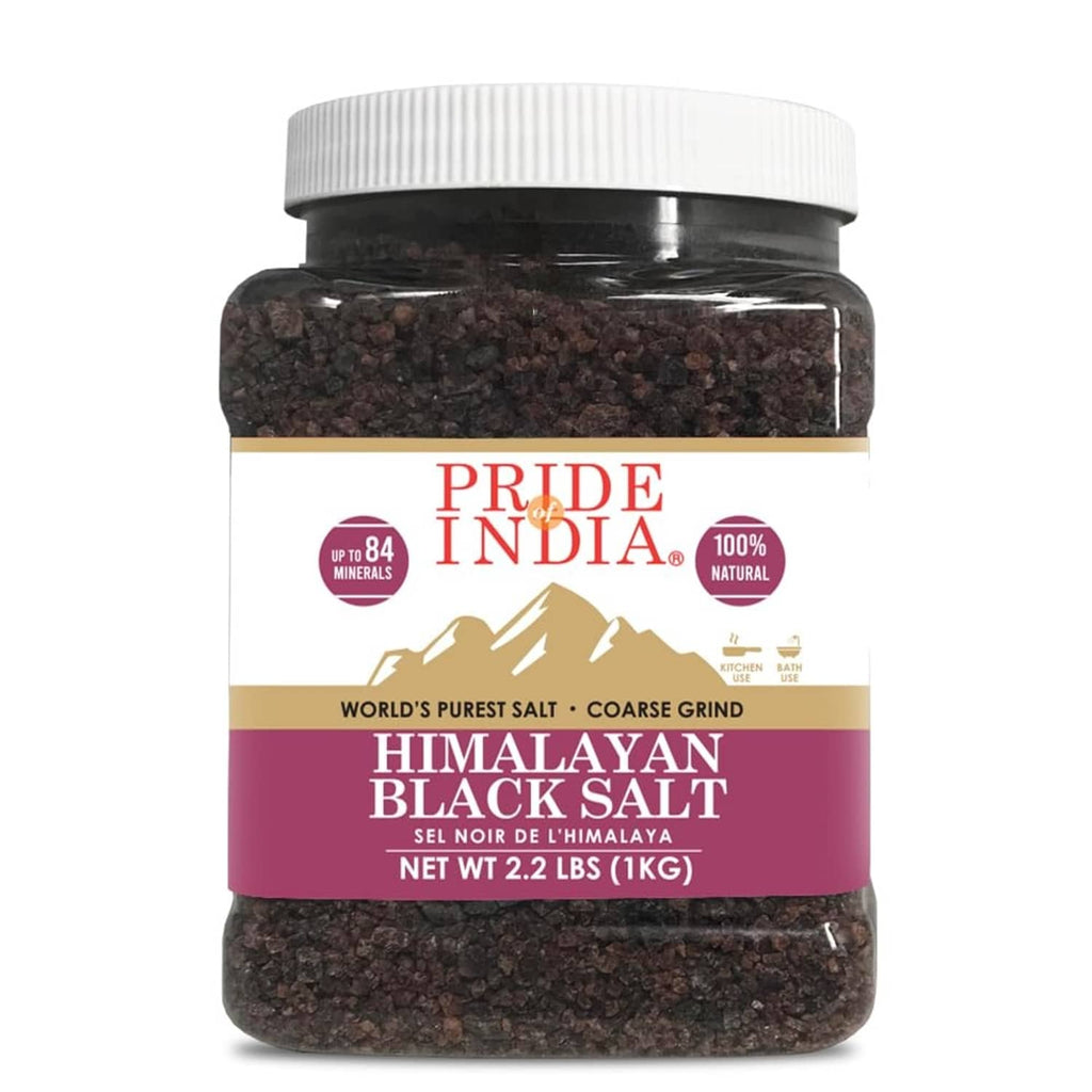 Coarse grind Himalayan black rock salt in clear jar with white cap and dark coarse crystals