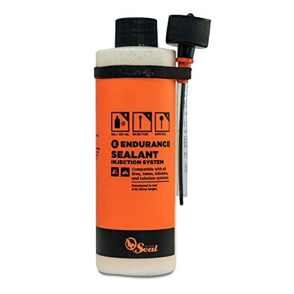 Orange bike tire sealant bottle with injector nozzle, black cap and label