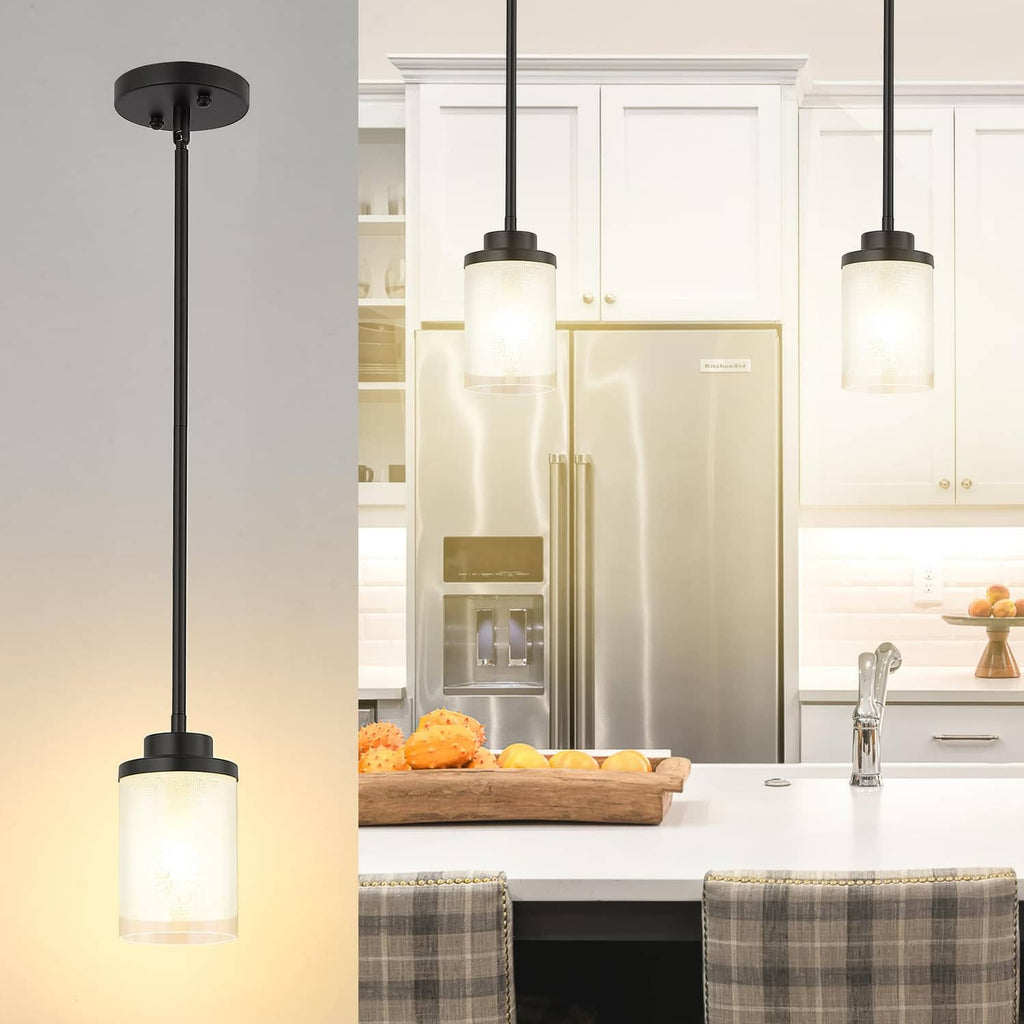 Matte black pendant light with frosted glass cylinder shade and round ceiling canopy.