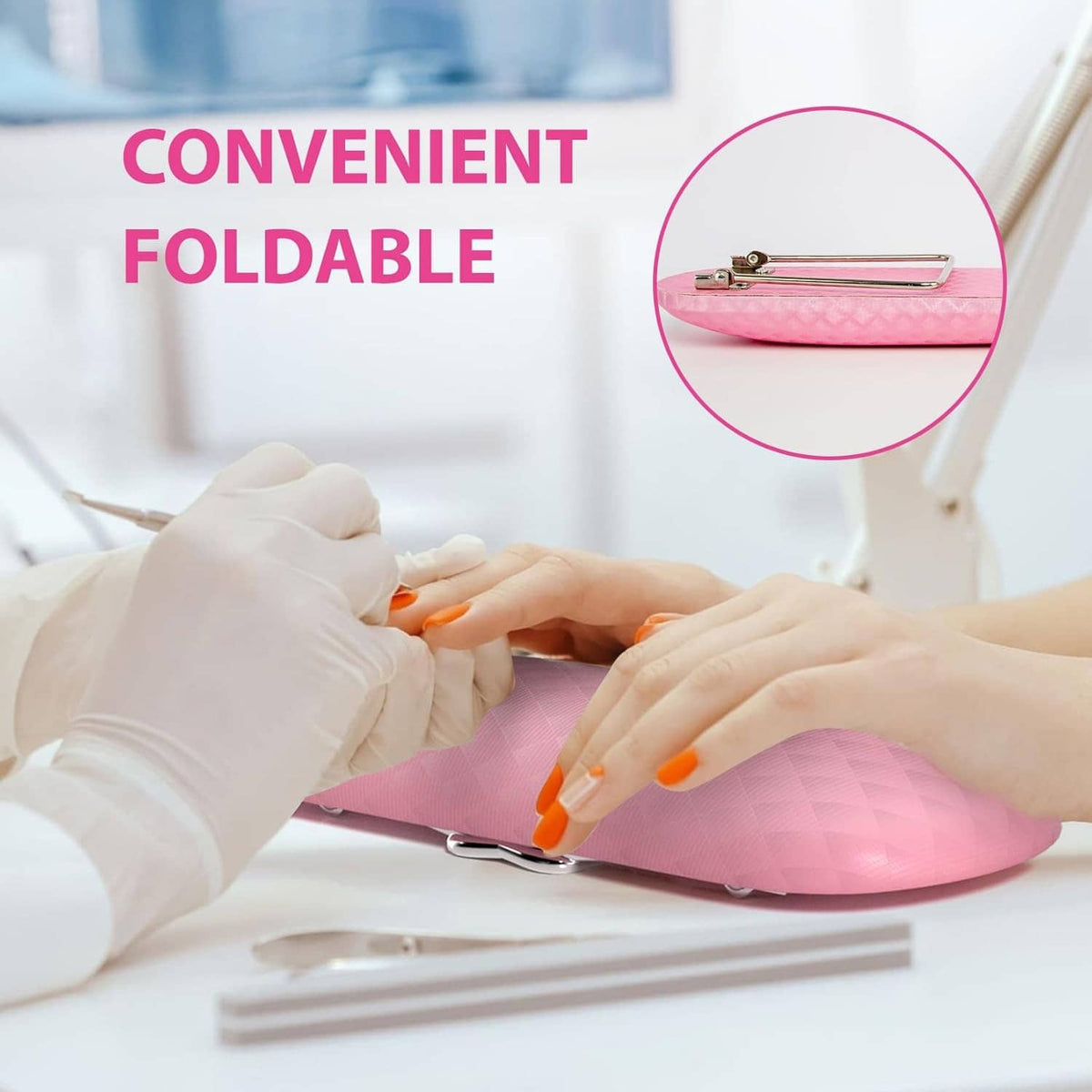 Pink foldable nail arm rest cushion with quilted surface as hands prep nails