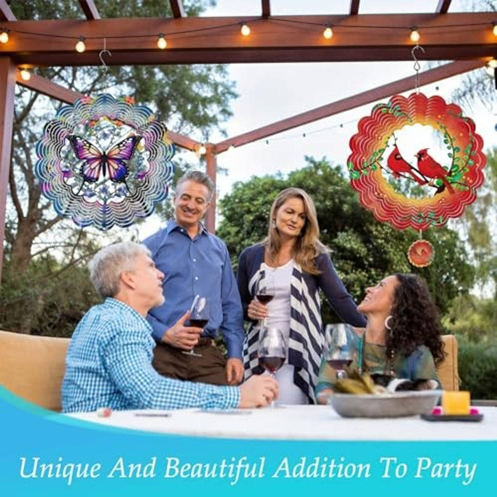 Colorful metal butterfly wind spinner hanging outdoors above a party table.