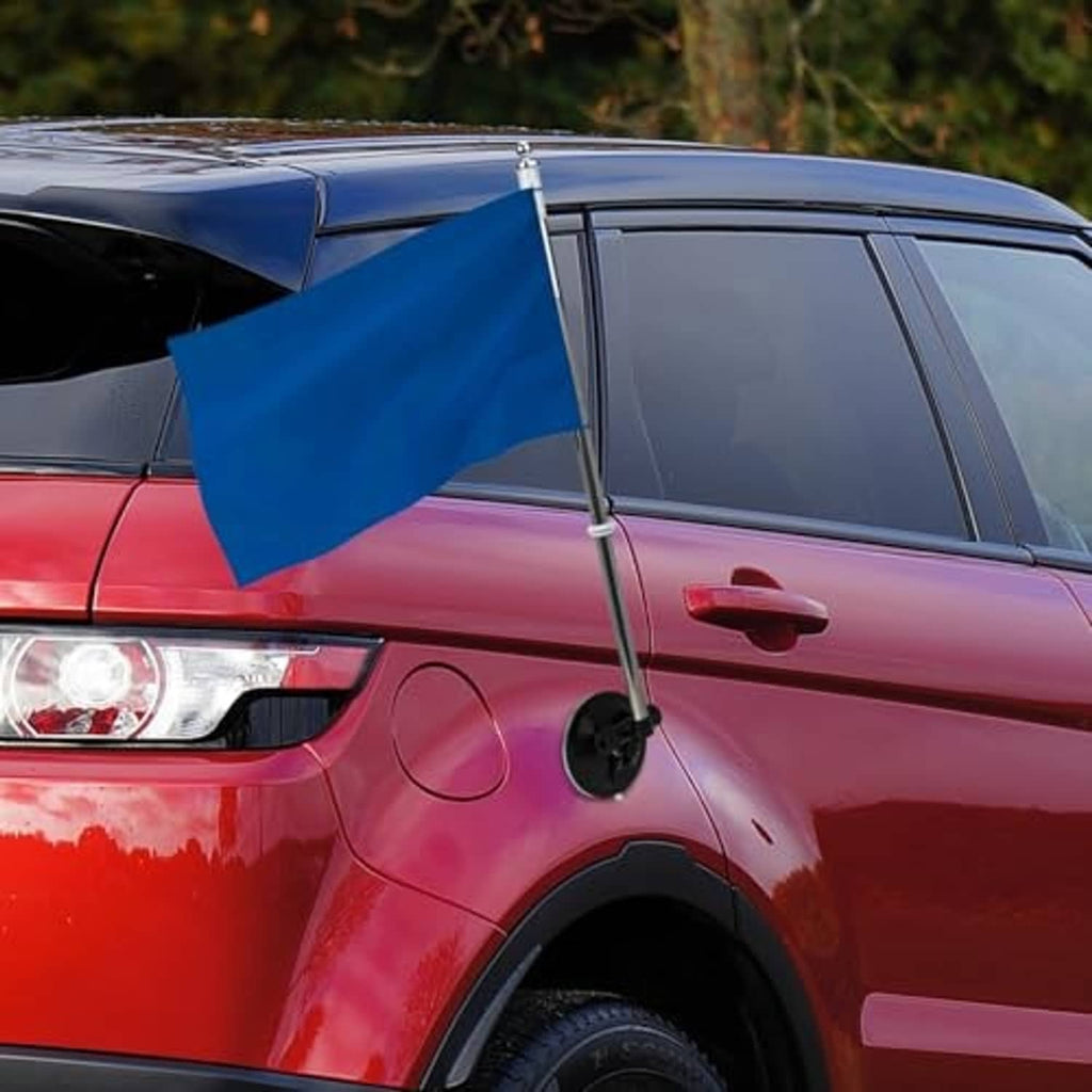 Car flagpole suction mount with blue flag on front fender