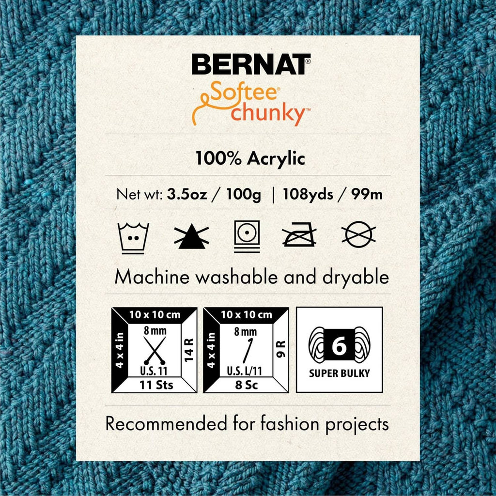 Blue chunky yarn knit swatch with 100% acrylic label and care icons