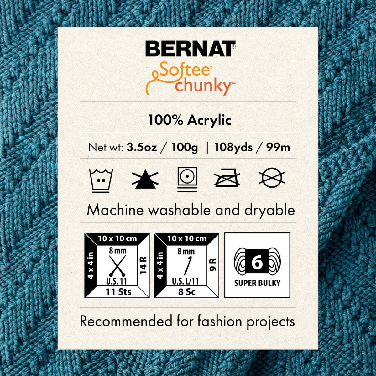 Blue chunky yarn knit swatch with 100% acrylic label and care icons