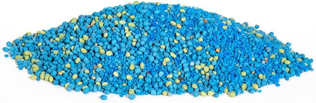 Clover seed pellets pile, blue and yellow coated granules