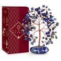 Lapis lazuli crystal tree with blue stone chips and red copper wire on oval base
