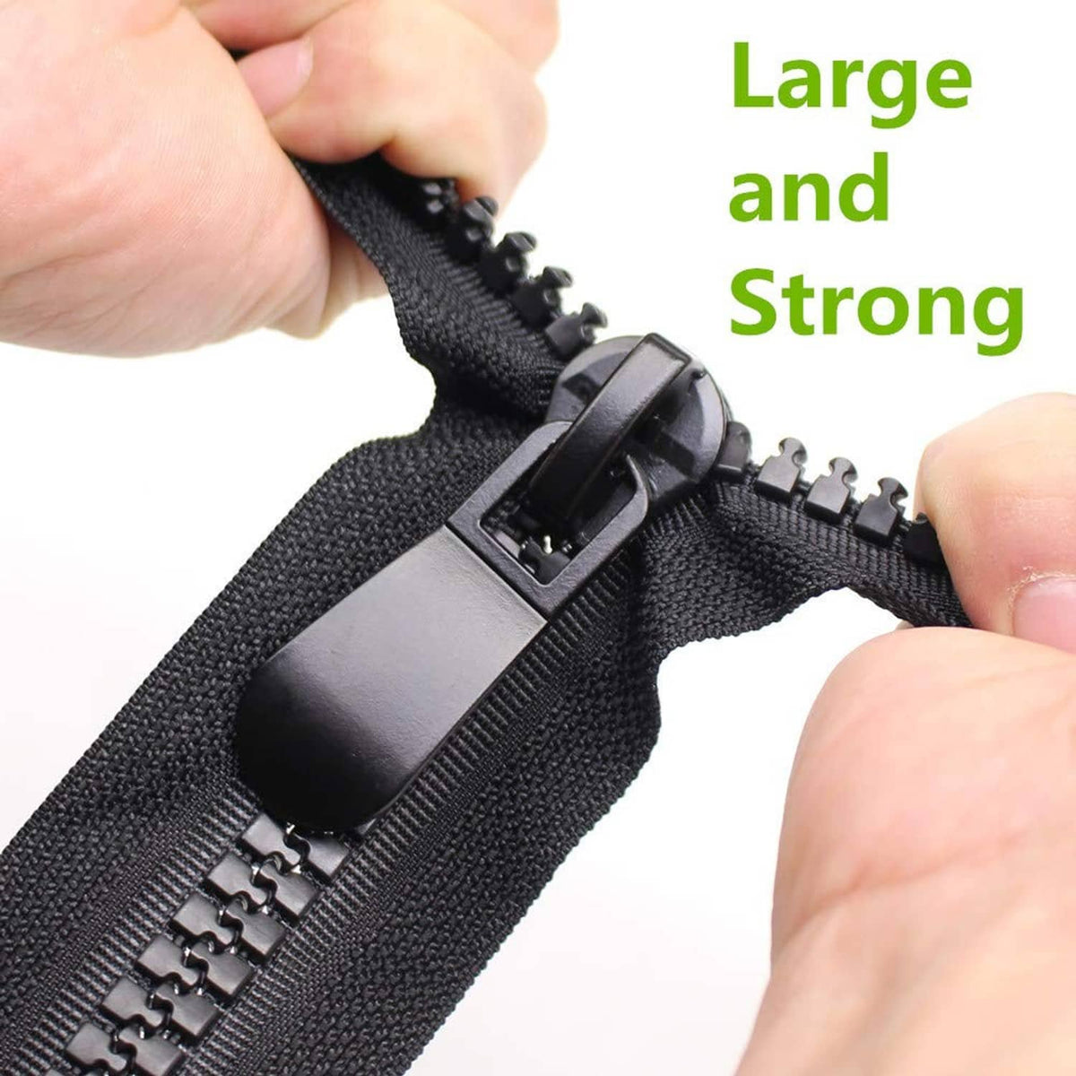Black two-way separating zipper close-up with two pull tabs and teeth