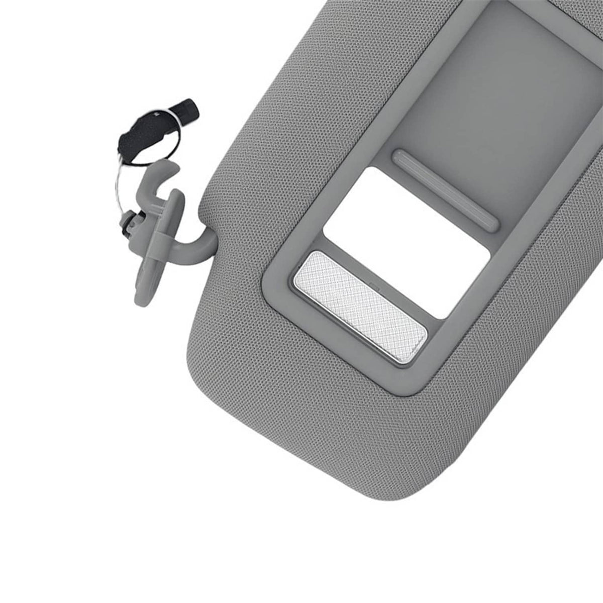 Gray sun visor with vanity mirror window and light strip detail on textured surface