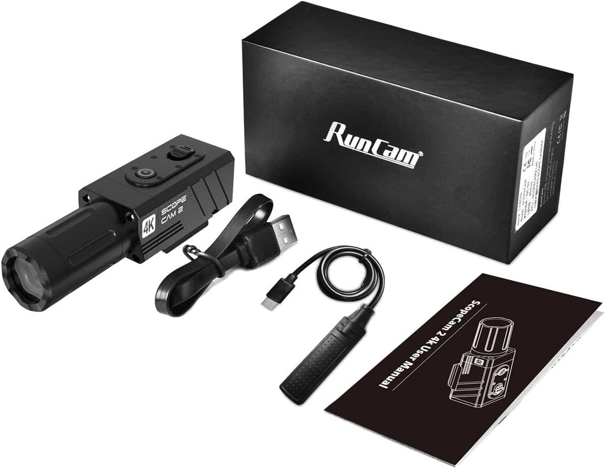 Black action camera kit with main device, mounting arm, cable, and accessories