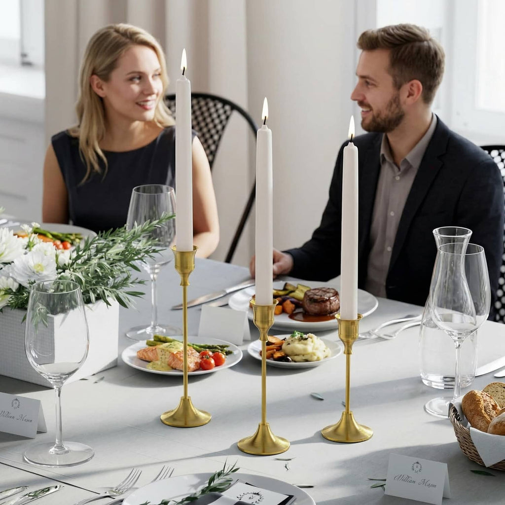 Brass gold candle holder set of six with lit candles on a table centerpiece